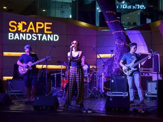 Harmony Amidst Hustle: How Music Eases the Stress of Singapore's Busy Professionals